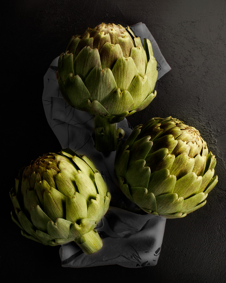 still life artichokes on a tea towel