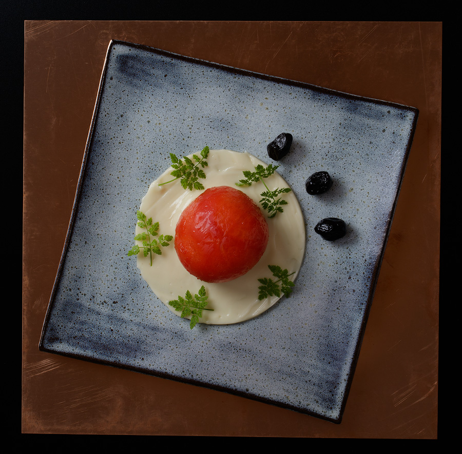 early tomato stuffed with couscous on a vegan miso mayo